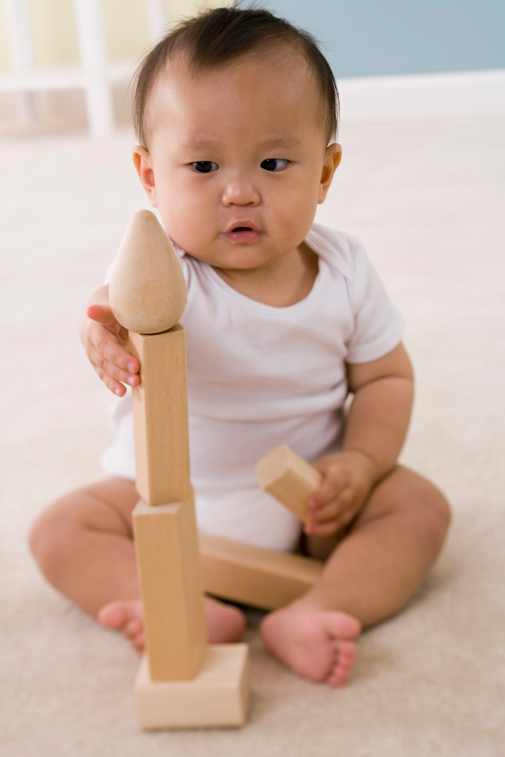 Baby playing with building blocks